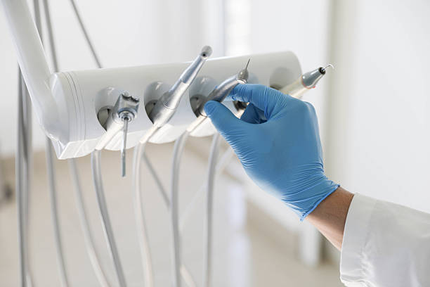 Professional Root Canal Treatment technician working in Lowell, MI